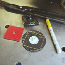 Load image into Gallery viewer, Close-up of a 3m 75mm roloc disc with yellow markings on a welding fabrication table with tools.