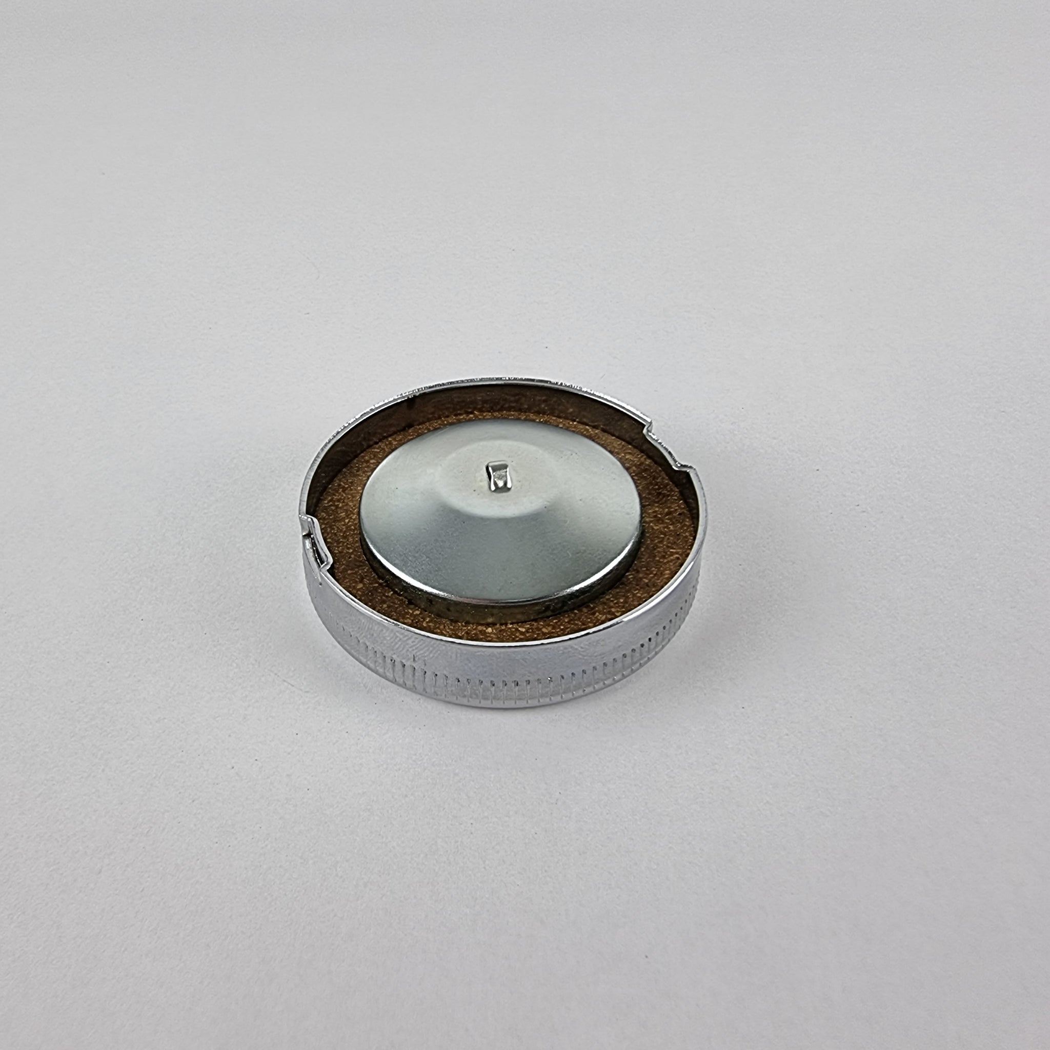 Underneath view of 2.5" Chrome British style Motorcycle Fuel Cap showing the hand cut cork gasket